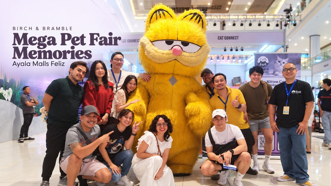 Birch & Bramble’s group at Ayala Malls Feliz with a Garfield mascot, beneath deep plum text reading Mega Pet Fair Memories.